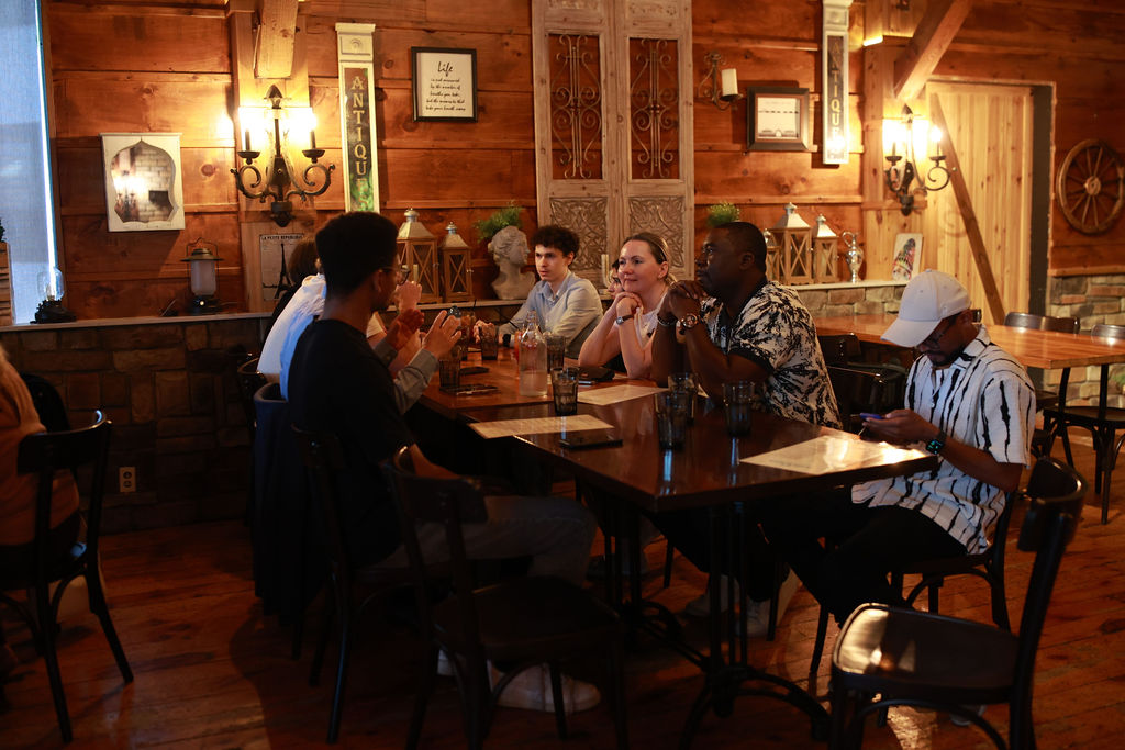 Guests in conversation across the table at a JN Network business networking event in Toronto