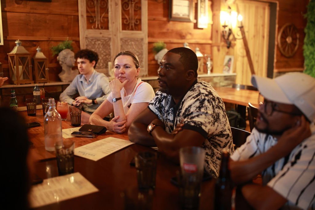 Guests in conversation across the table at a JN Network business networking event in Toronto
